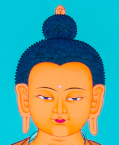 beautiful face of Shakyamuni Buddha from a hand-painted thangka. 